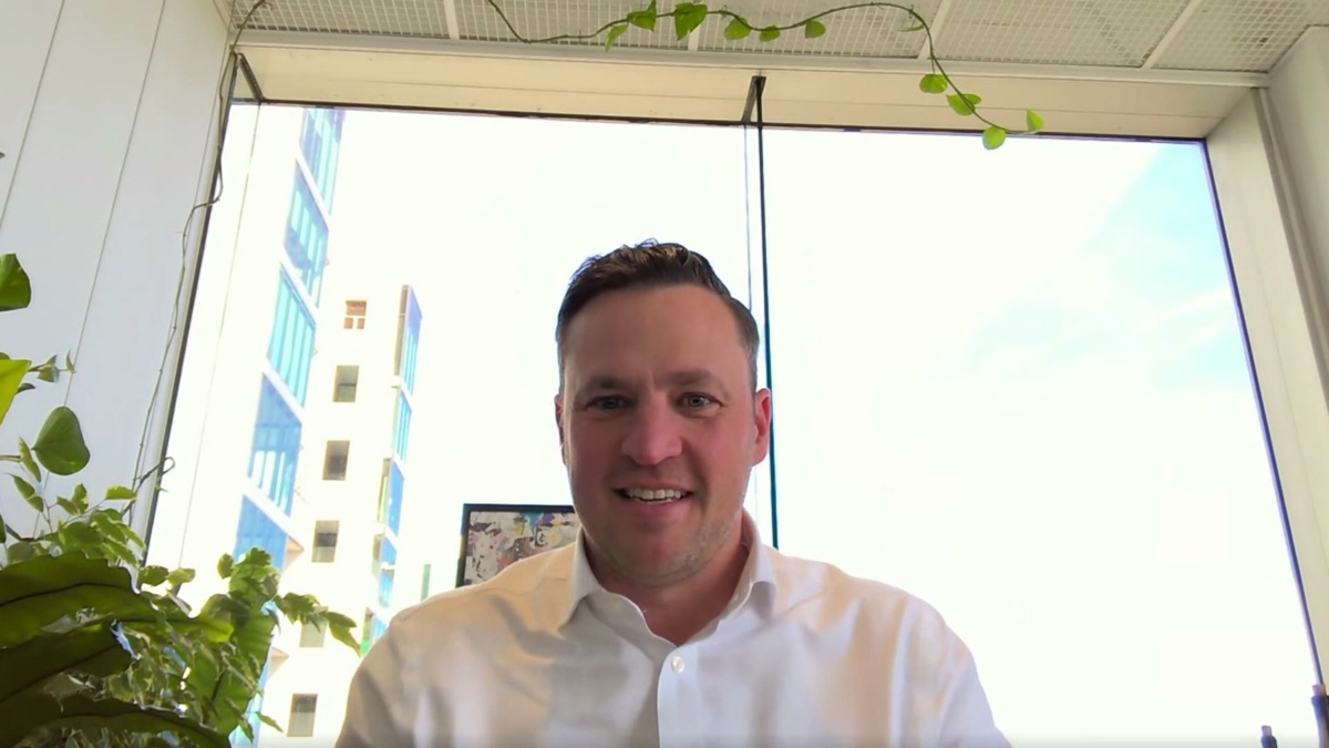 Karl Simity of Canopy Fitouts, speaking to camera in his office during the recorded session